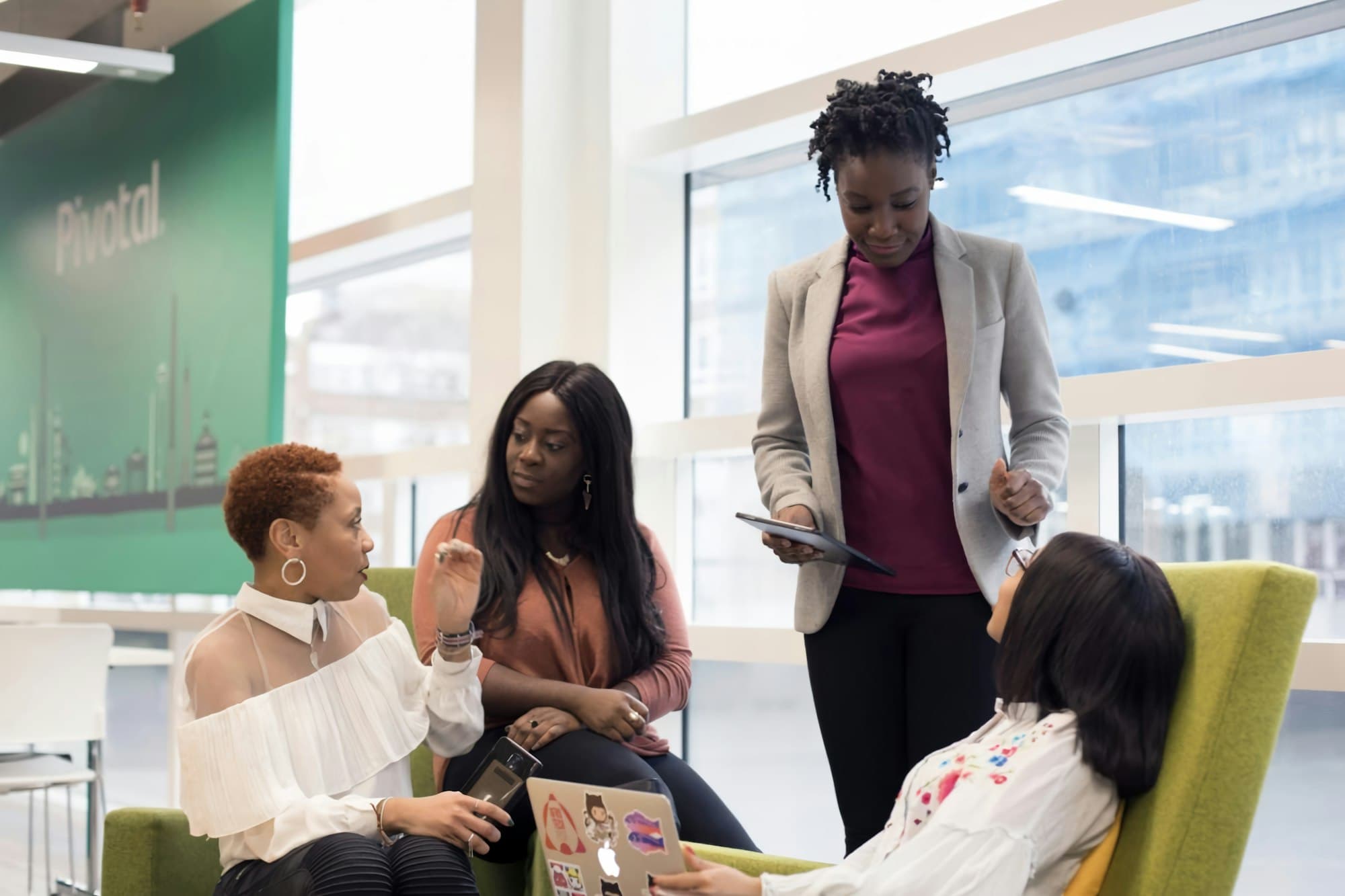 An HR team in a meeting in a large office